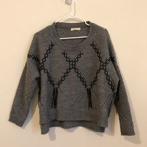 Grey sweater with black fringe M